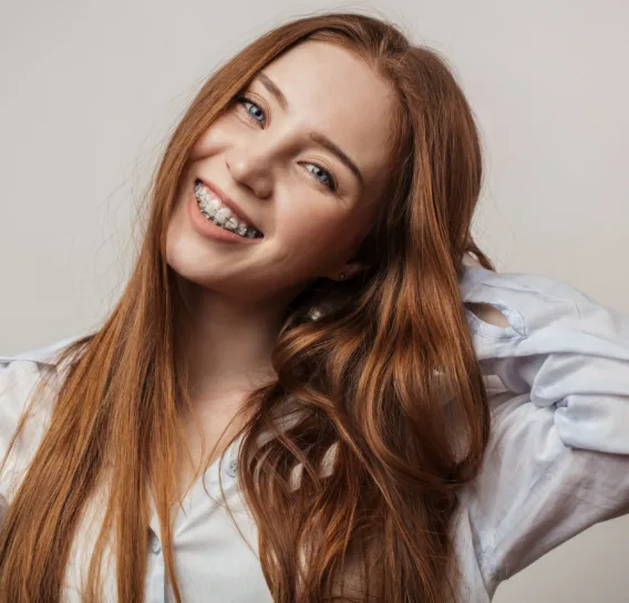Woman smiling with clear ceramic braces